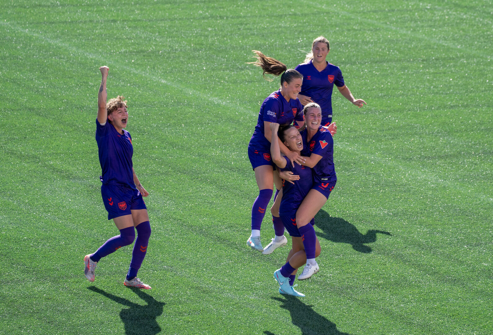 Meikayla Moore celebrating a goal with teammates